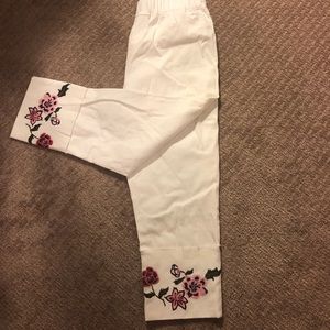 NWOT White leggings with floral embroidered cuffs